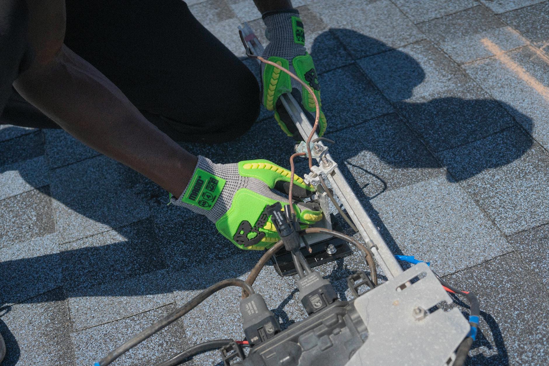 A Prime Ridge Roofing technician performing a detailed roof inspection on a Henderson home.