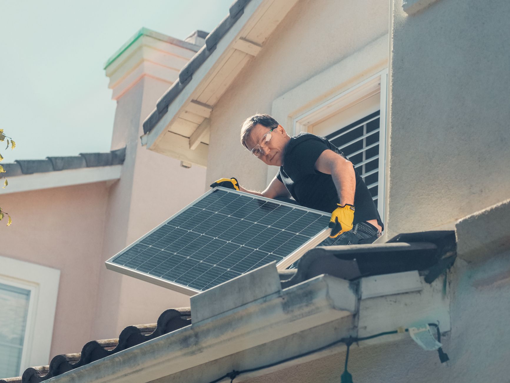 A close-up of a roofing technician from Prime Ridge Roofing carefully inspecting a tile roof for cracked or slipped tiles on a Sunrise Manor home.